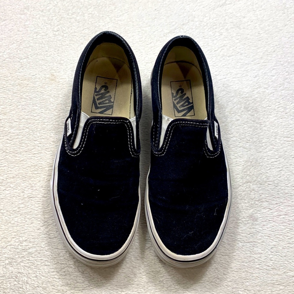 Women’s black slip on Vans size 7.